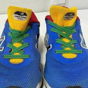 New Balance Kids Blue Sneakers with Yellow Tongue and Green Laces